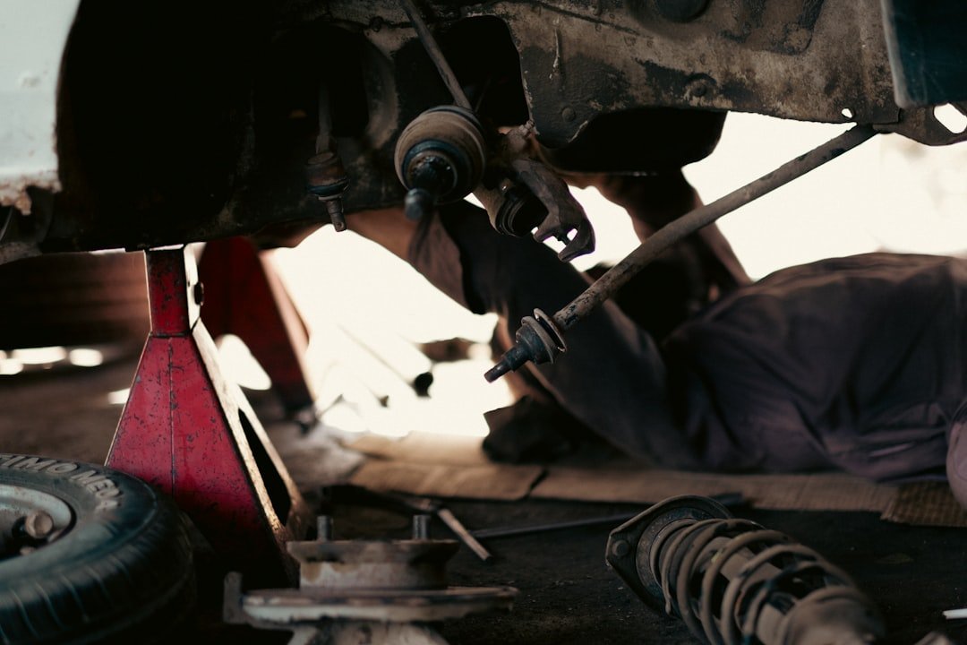 Crafting Captivating Headlines: Your awesome post title goes here Busy Automobile Workshop: Mechanics at Work in a Garage